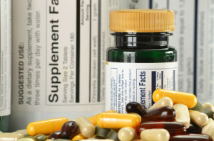 Composition with dietary supplement capsules and containers